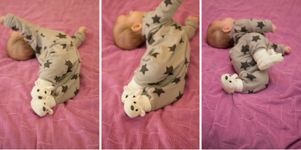 Infant attempting to roll from back to front